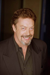   (Tim Curry)